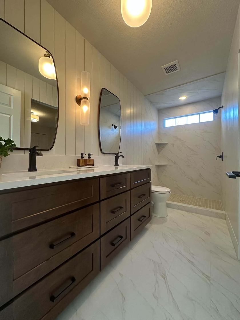 Double vanity · vaulted + walk-in shower — bath remodels by Kovo's Karpentry in Boise, Idaho