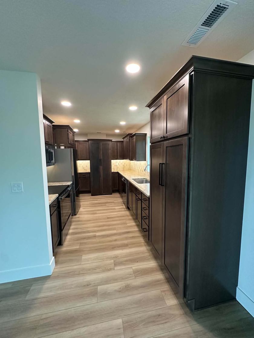 Galley kitchen · dark cabinetry — kitchen remodels by Kovo's Karpentry in Boise, Idaho
