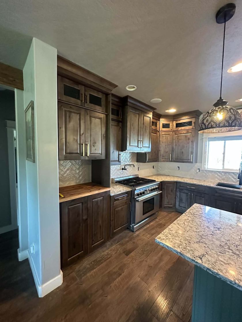 Kitchen remodel in Boise, Idaho — granite island, custom cabinetry, hardwood floors