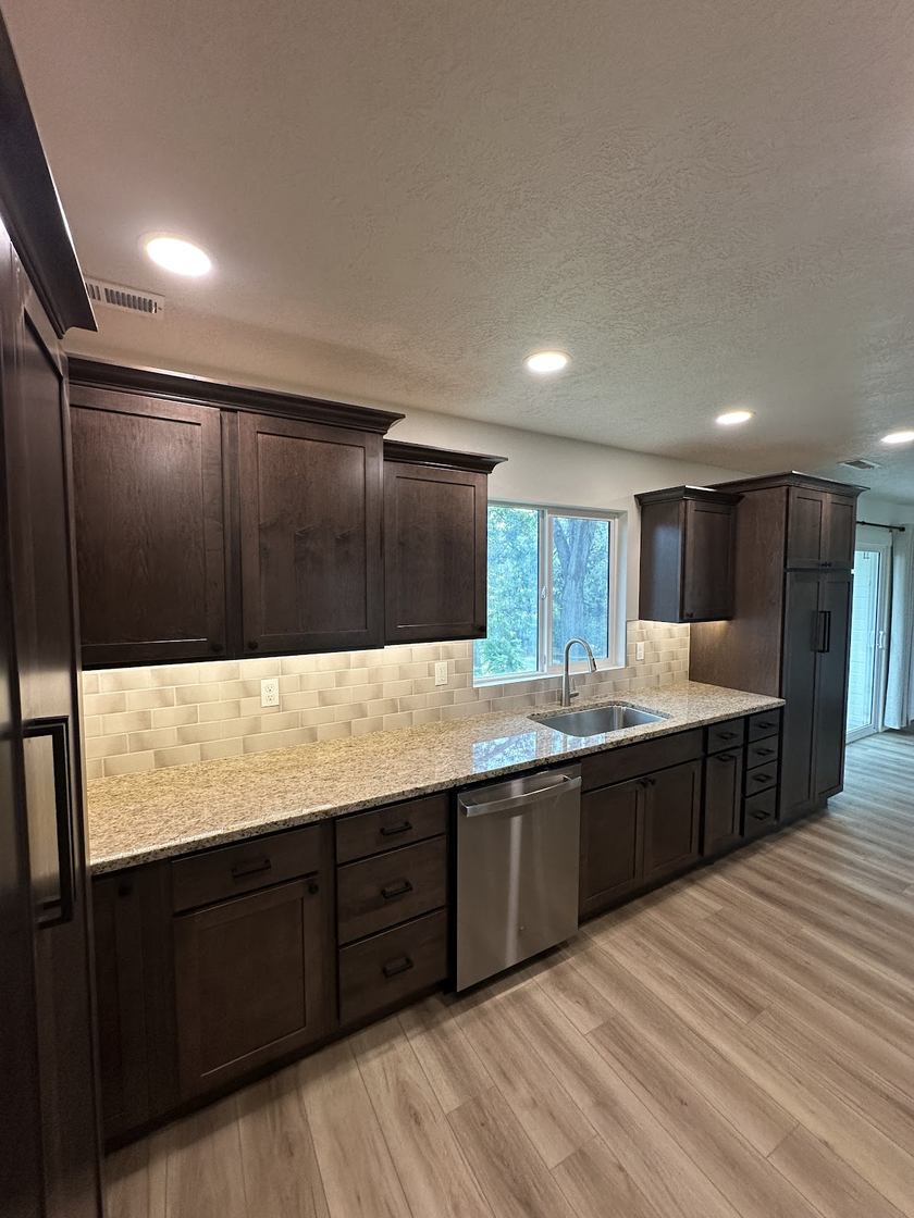 Custom tile backsplash and granite countertops by Kovo's Karpentry in Boise, Idaho
