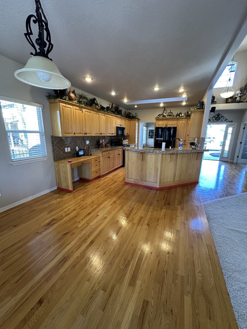 Open oak kitchen · hardwood floors — flooring by Kovo's Karpentry in Boise, Idaho