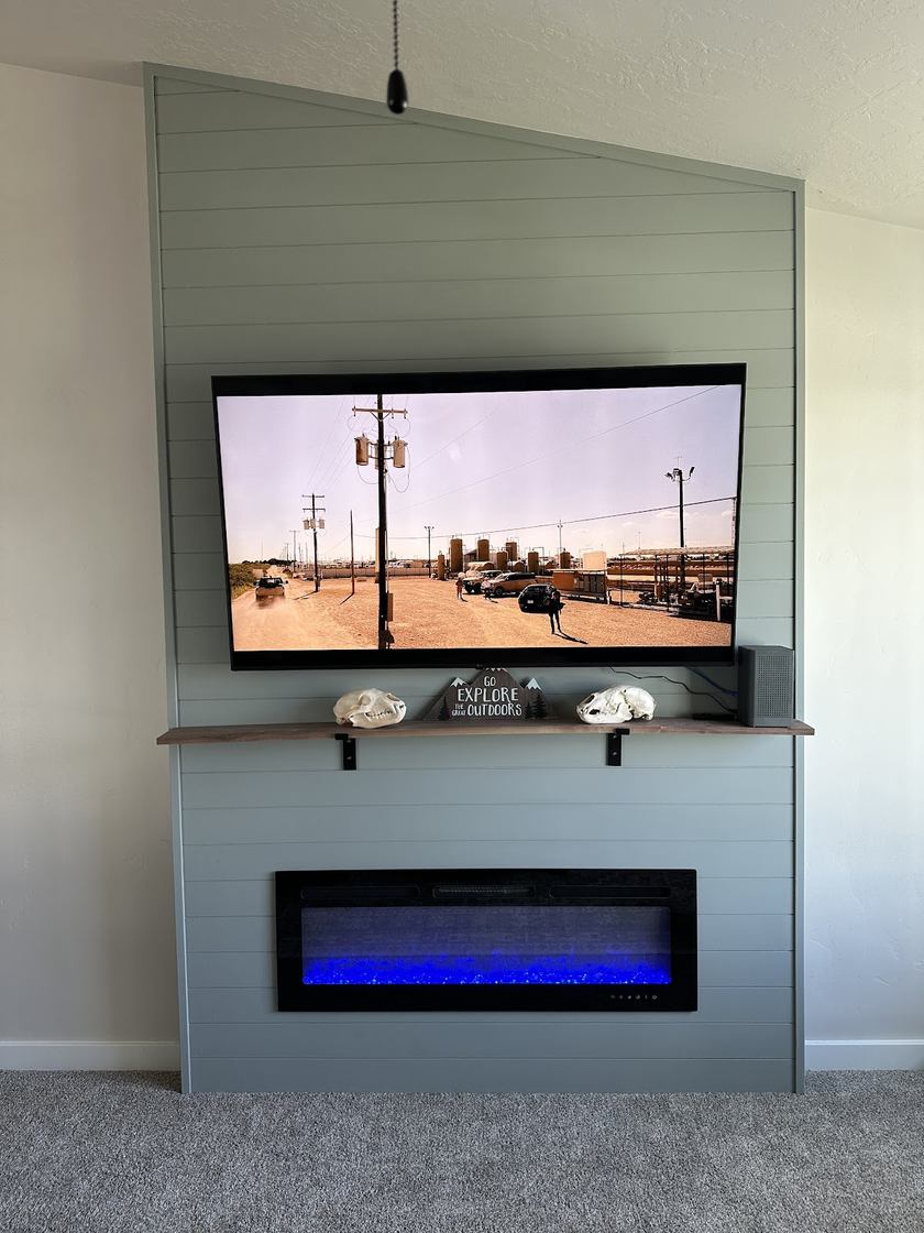 Custom shiplap media wall · built-in fireplace — cabinetry by Kovo's Karpentry in Boise, Idaho