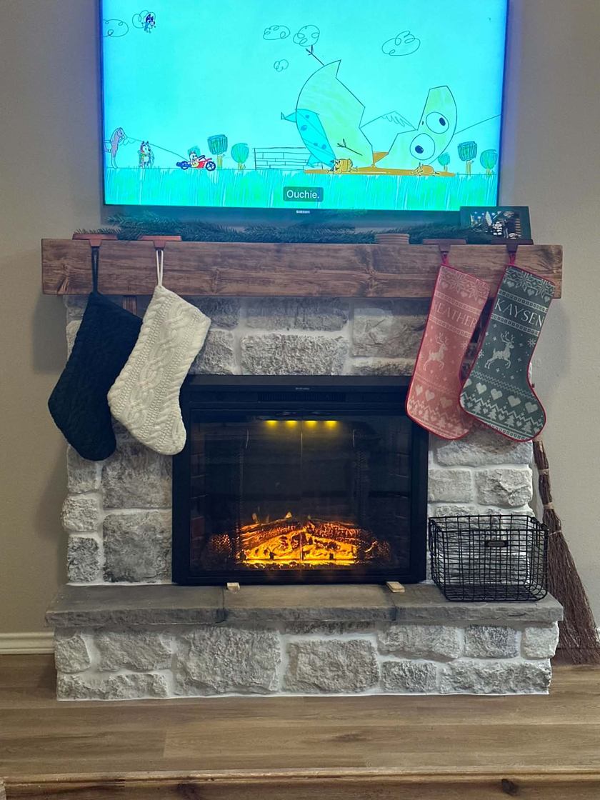 Stone fireplace · reclaimed-wood mantel — custom tile by Kovo's Karpentry in Boise, Idaho